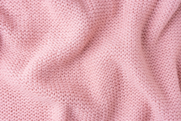 Pastel pink knitwear wool fabric texture background Abstract textile backdrop