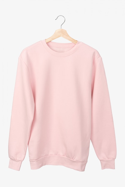 Pastel pink long sleeve t-shirt on a hanger