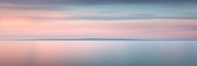 A pastel sky with a beach and ocean in the background.