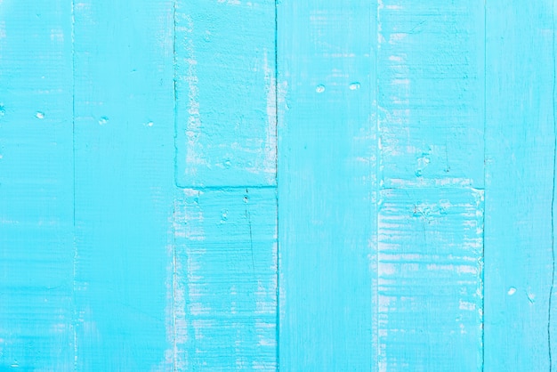 Pastel white and blue wooden table background texture.