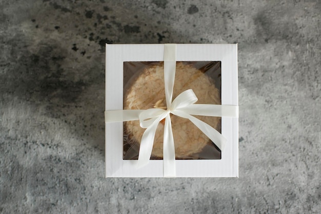 Pastries in a box decorated with a satin ribbon