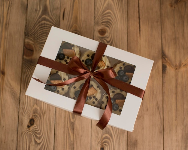 Pastries in a box decorated with a satin ribbon