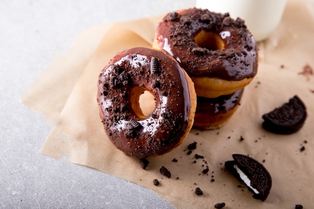 Pastries concept. Donuts with chocolate glaze and chocolate cookies