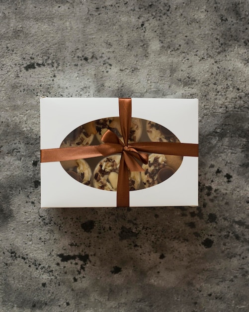 Pastries decorated with chocolate in a box