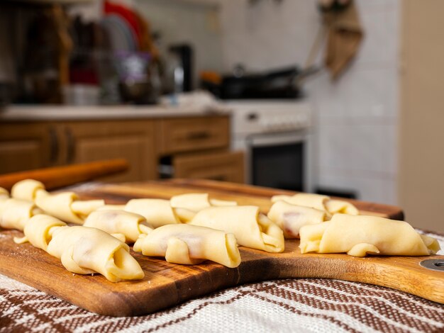 Pastry and baking concept. Preperation of homemade rolls with jam at home