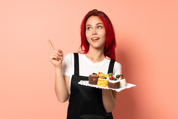 Pastry chef holding a muffins