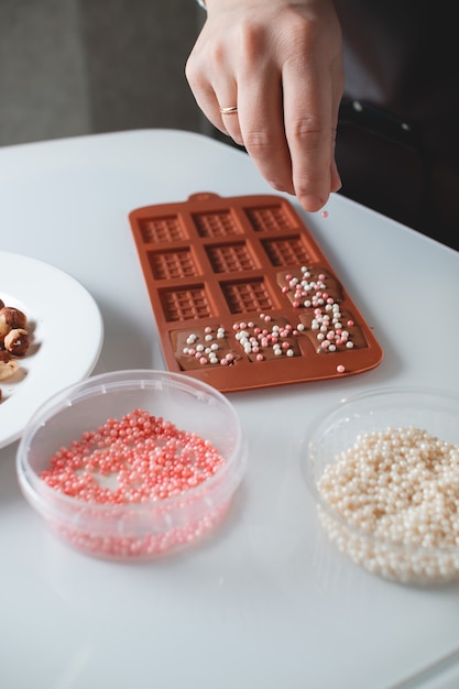 the pastry chef is making chocolate