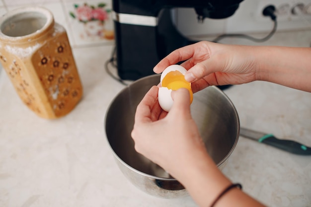 Pastry chef makes cake. Cooking and beat eggs.