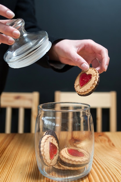 Pastry food cookie woman hand taking biscuit jar