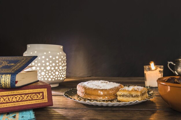 pastry near books lantern High quality beautiful photo concept