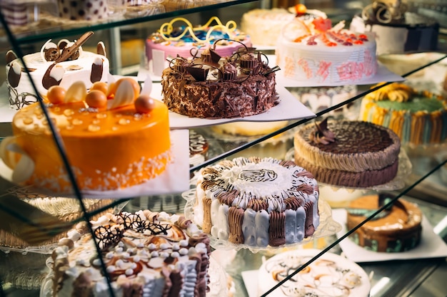 Pastry shop glass display with selection of cakes