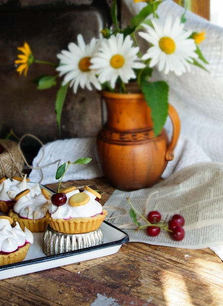 Pastry tartlets with meringue and cherry                               