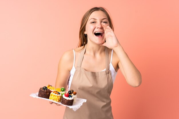 Pastry Ukrainian chef holding a muffins