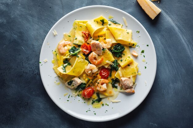 Pasty with shrimps and vegetables on plate