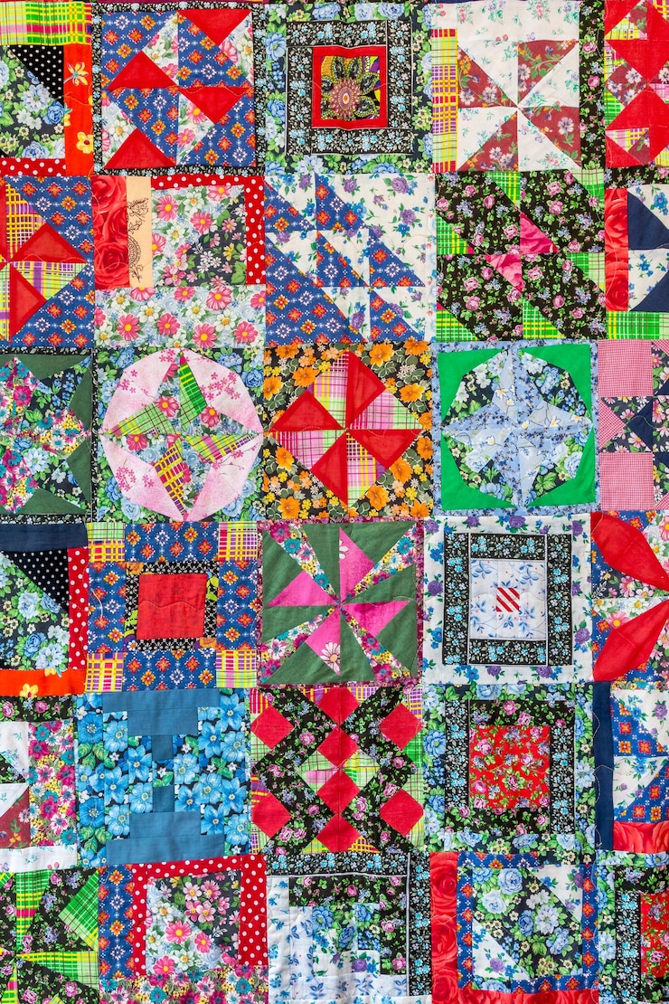 Photo the patchwork-style bedspread is made of multicolored pieces of natural fabric. handmade product
