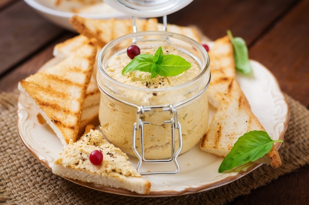 Pate Chicken, toast and herbs on a plate