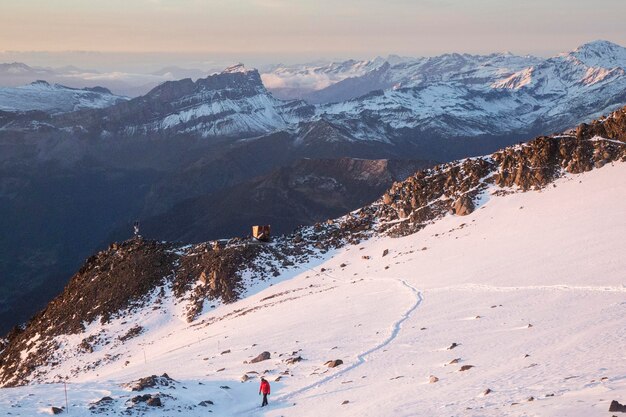 Path in the snow in the French Alps at the sunset