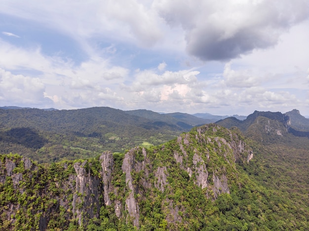 Path through the green forest and countryside of Thailand, Top view aerial photo from drone