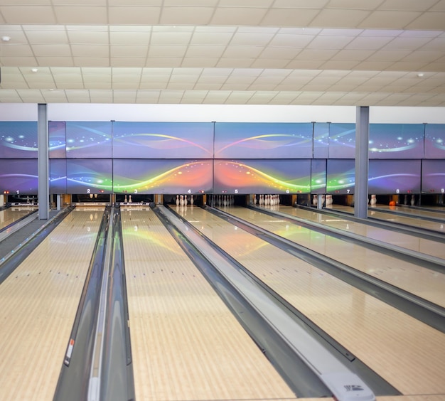 Paths with balls and pins for bowling. A fun game for the company.