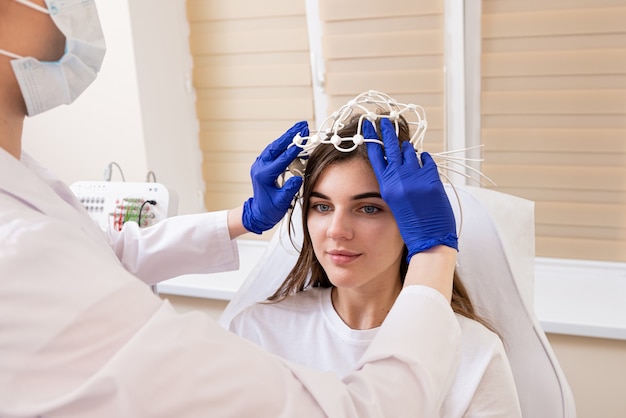 Photo patient brain testing using encephalography at medical center