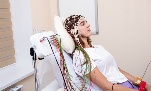 Patient brain testing using encephalography at medical center