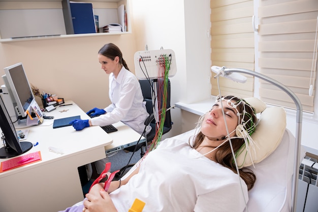 Photo patient brain testing using encephalography at medical center