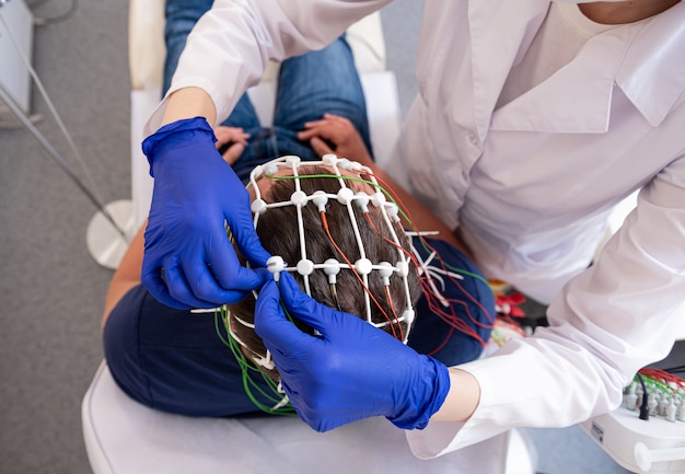 Patient brain testing using encephalography at medical center