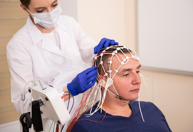 Photo patient brain testing using encephalography at medical center