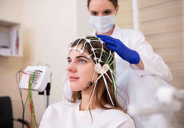 Patient brain testing using encephalography at medical center