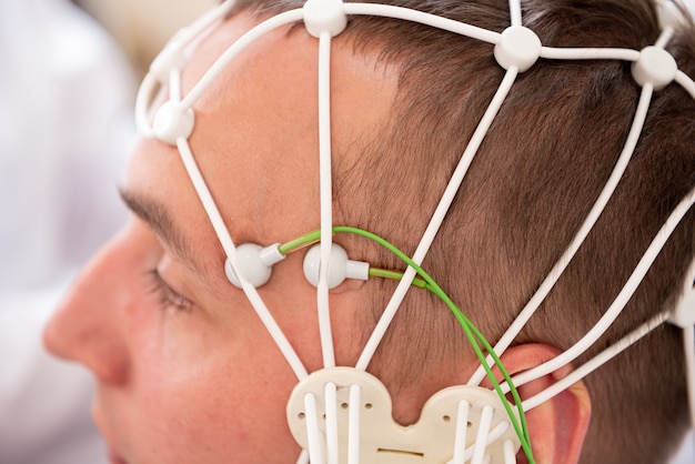 Photo patient brain testing using encephalography at medical center
