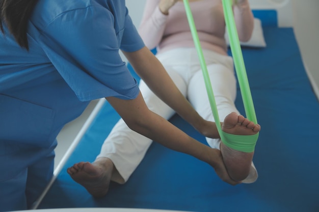 Patient doing some special exercises under supervision in a room