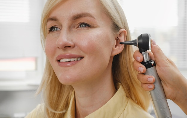 Patient having checkup of hearing at doctor otolaryngologist