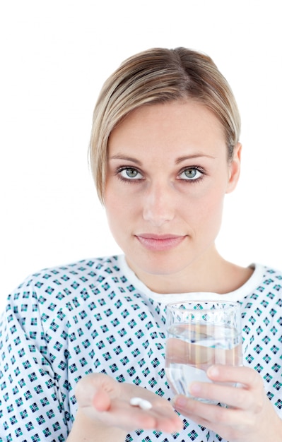 Patient holding a glass of water