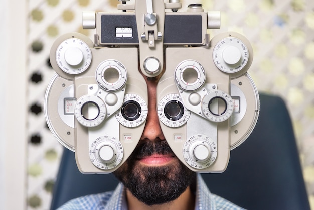 Photo patient in modern ophthalmology clinic checking the eye vision.