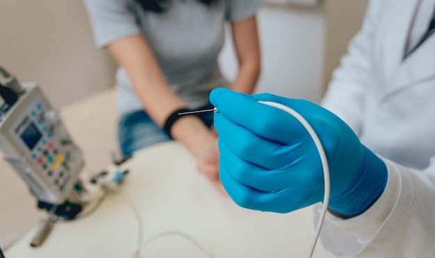 Patient nerves being tested using electromyography. 