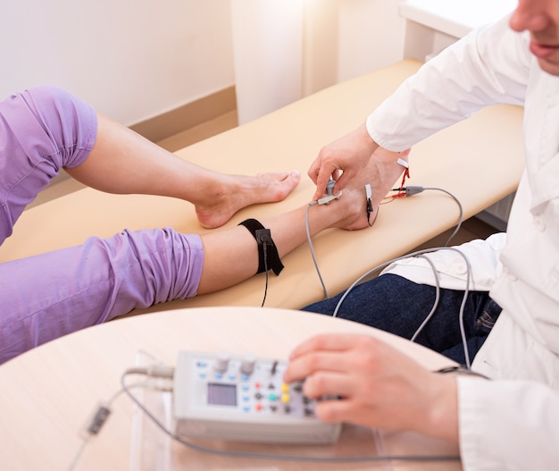 Patient nerves testing using electromyography at medical center