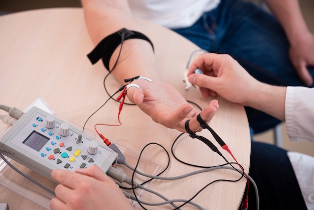 Patient nerves testing using electromyography at medical center