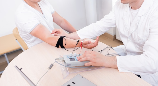 Patient nerves testing using electromyography at medical center