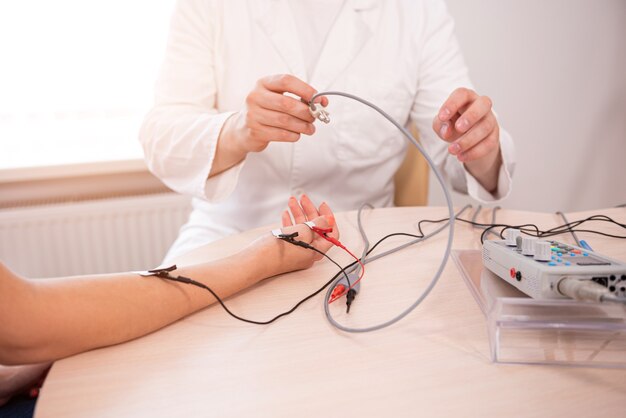 Patient nerves testing using electromyography at medical center