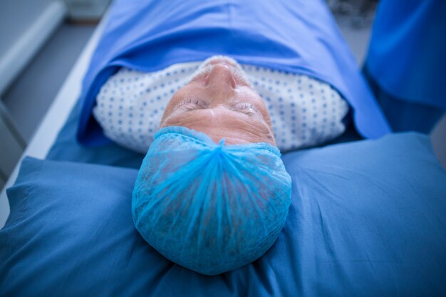 Patient relaxing on bed in x-ray room