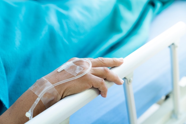 The patient's hands, waiting for help in the hospital