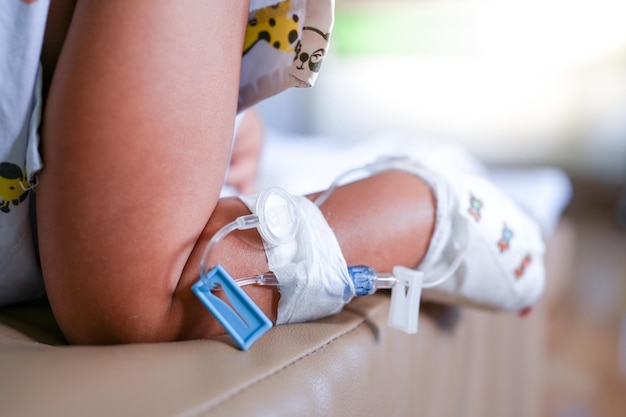 A patient's leg with a tube that says iv drips on it