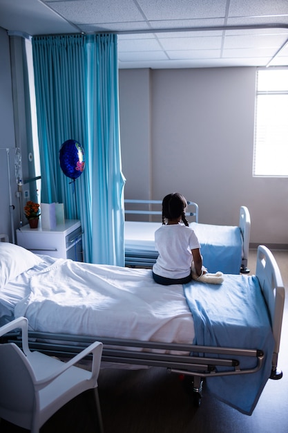 Patient sitting on bed