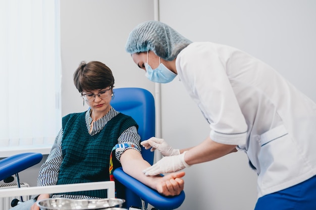 The patient takes a blood test at the clinic high quality photo