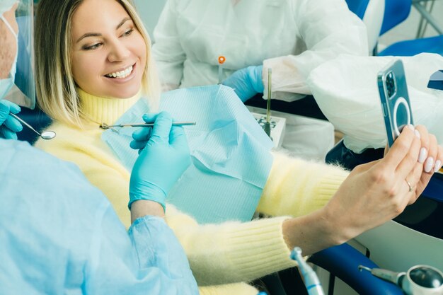 Patient takes a photo after dentist work