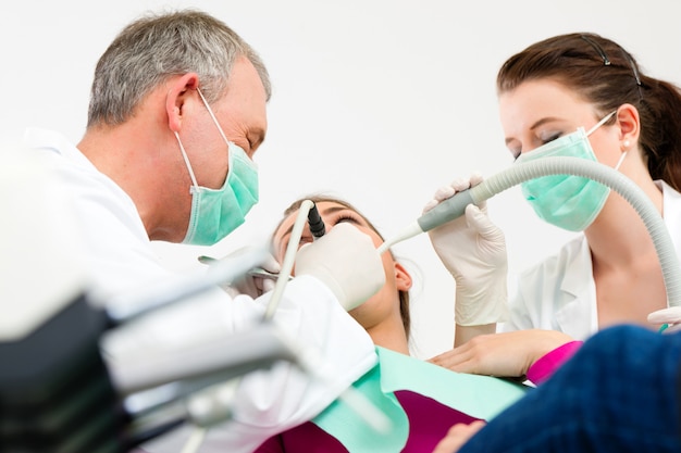 Patient with Dentist - dental treatment