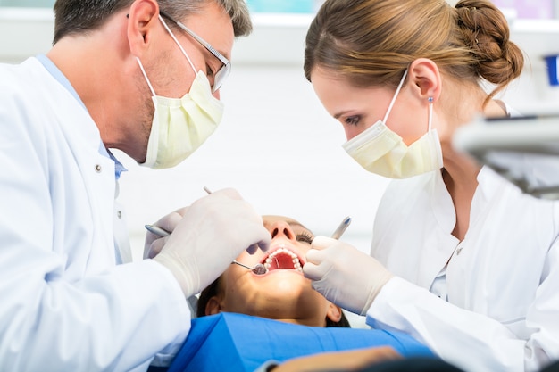 Patient with dentist - dental treatment