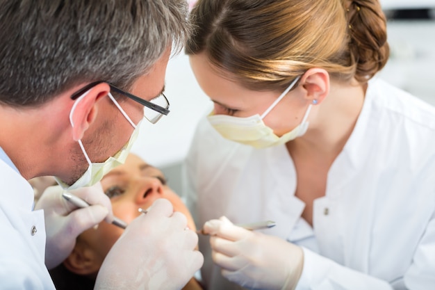 Patient with Dentist - dental treatment