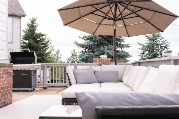 Patio of a luxury single-family home furnished with modern furniture.