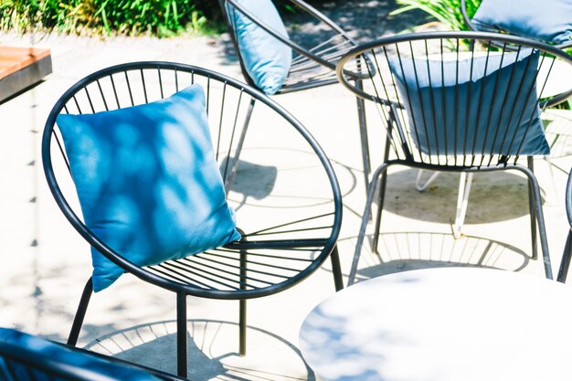 Photo patio with pillow on chair and table set